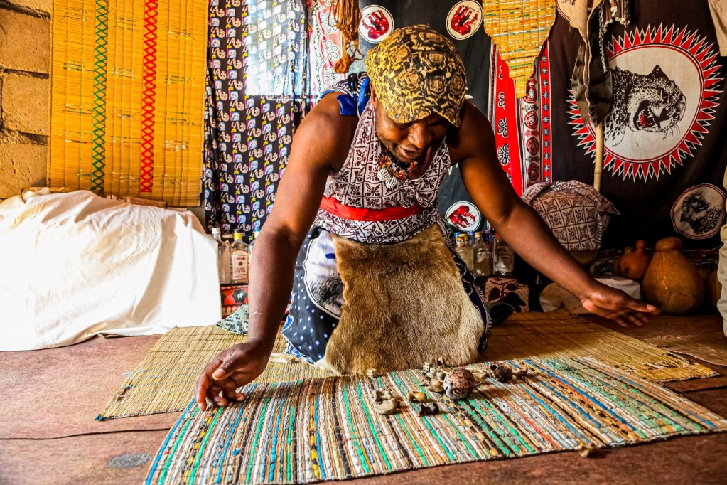 African Male Traditional Healer performing a spiritual reading